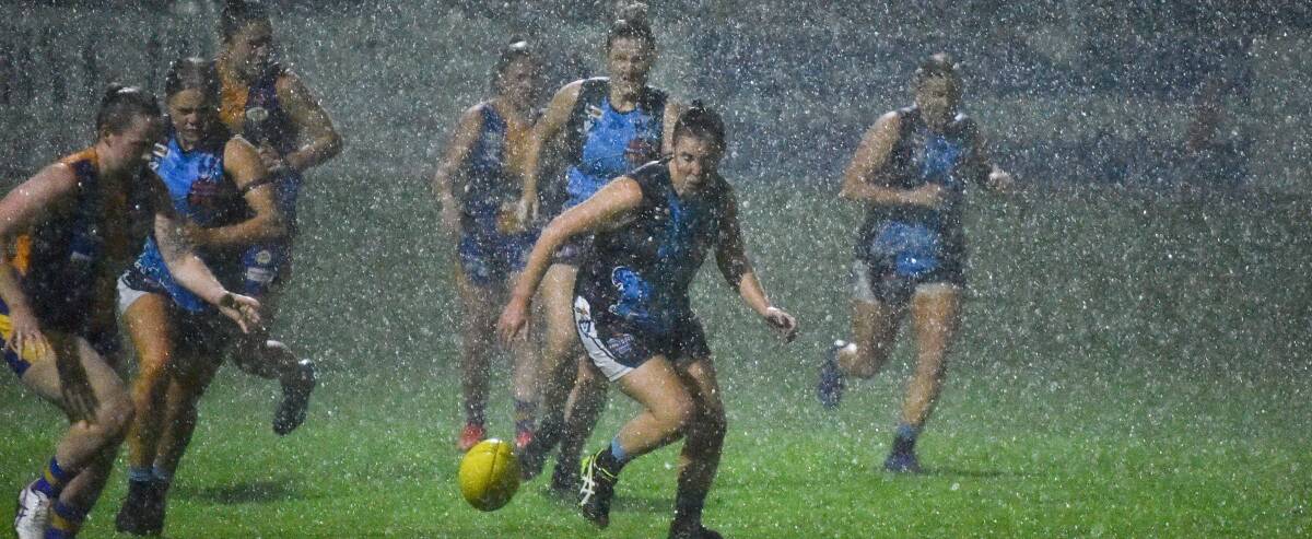 Wet weather caused havoc on Friday night during the clash between Eaglehawk and Golden Square at Canterbury Park. Pictures: NONI HYETT