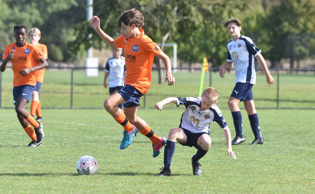 TOUGH OPPOSITION: Bendigo CIty FC under-14s had a challenging clash against Ballarat on Sunday. Picture: NONI HYETT