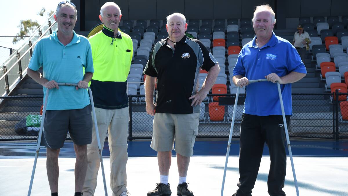 OVERDRIVE: Bendigo Tennis volunteers Mark Purdon, Neil Rowan, Frank Hill and Brian Watson have been preparing the courts at the Fosterville Golden Tennis Centre for the tournament which starts on Monday. Picture: ANTHONY PINDA