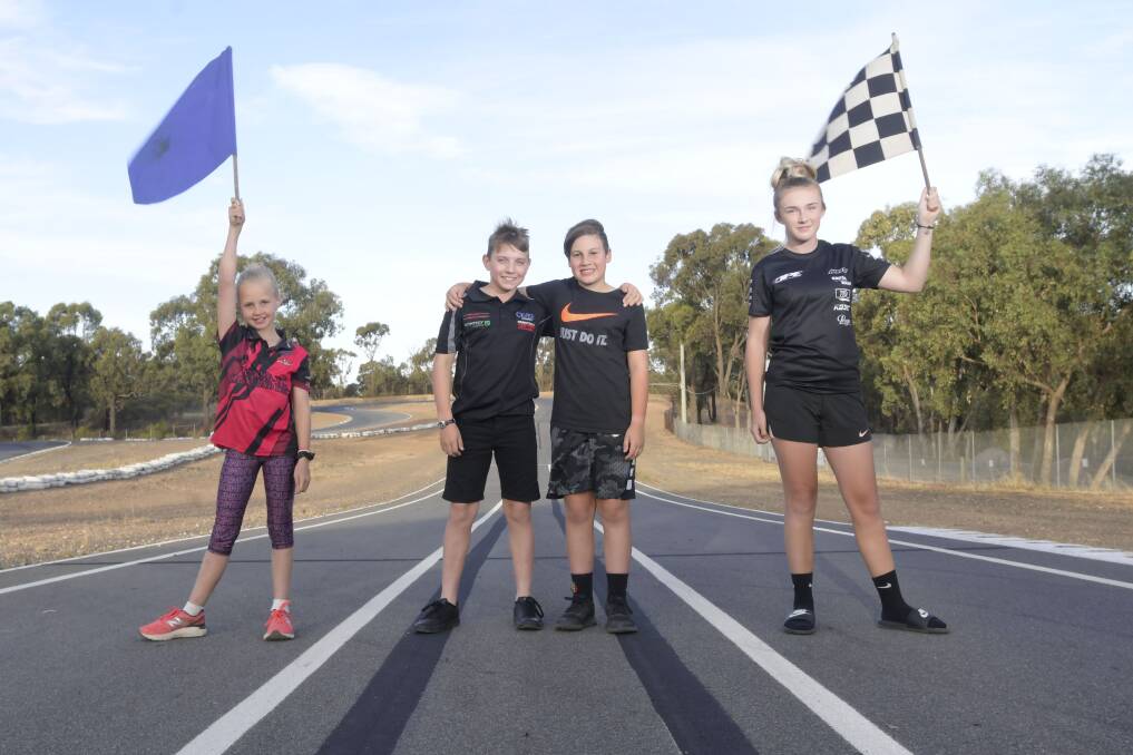 ON THE GRID: Bendigo Kart Club members Chelsea Humphrey, James Ceveri, Ethan Cornwill and Charlee Richardson have been given the once in a lifetime opportunity to be Grid Kids at the 2019 Australian Grand Prix. Picture: NONI HYETT