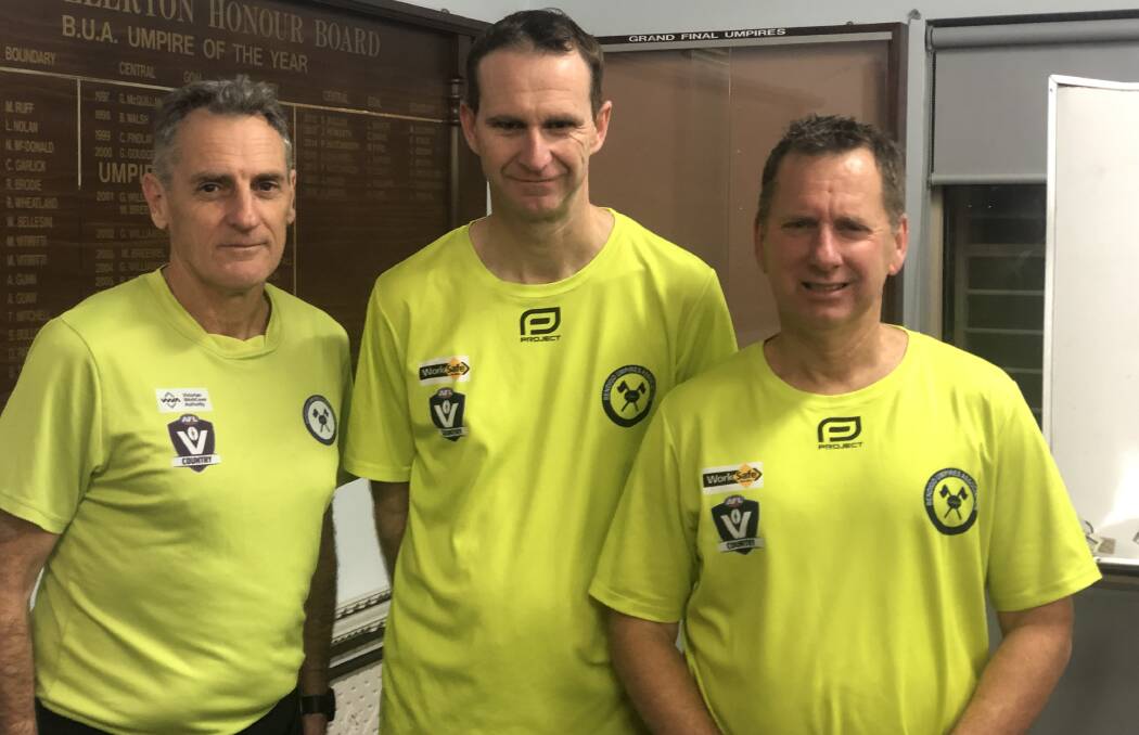 DOUBLE CENTURY: Bendigo Umpires Association's Paul Smythe, John Norton and Dale Caldwell have enjoyed every moment of their time on the field as umpires.