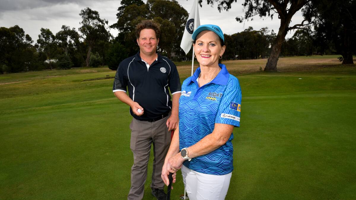 TEE UP FOR MND: Julie Baird and Bendigo Golf Club operations manager Liam Carney. Picture: NONI HYETT