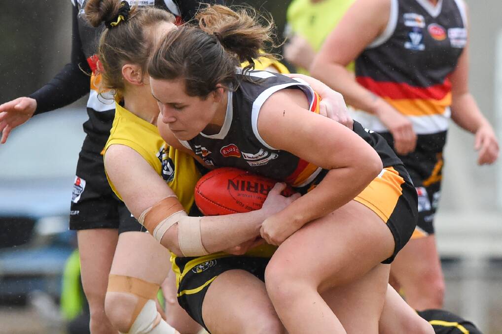 Thunder's Megan Williamson gets taken down by a Kyneton player during the 40-point win on Sunday.