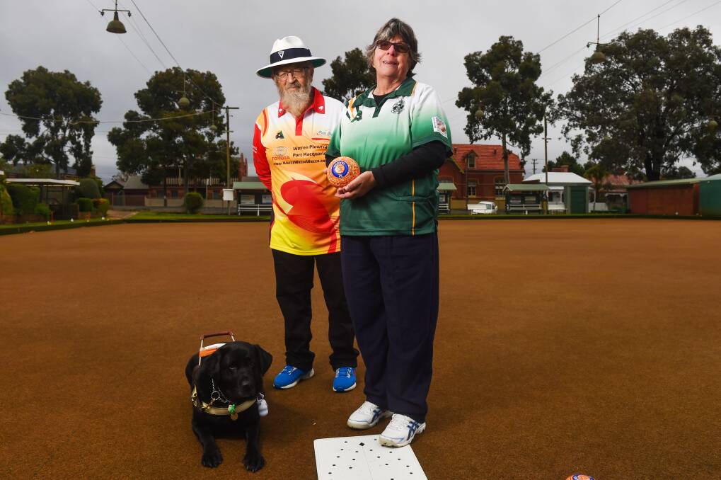 GOLDEN ROLL: With help from husband Brian and guide dog Letty, Margaret Rosewall won gold at the 2021 National Blind Bowlers Championships in Port Macquarie. Picture: DARREN HOWE