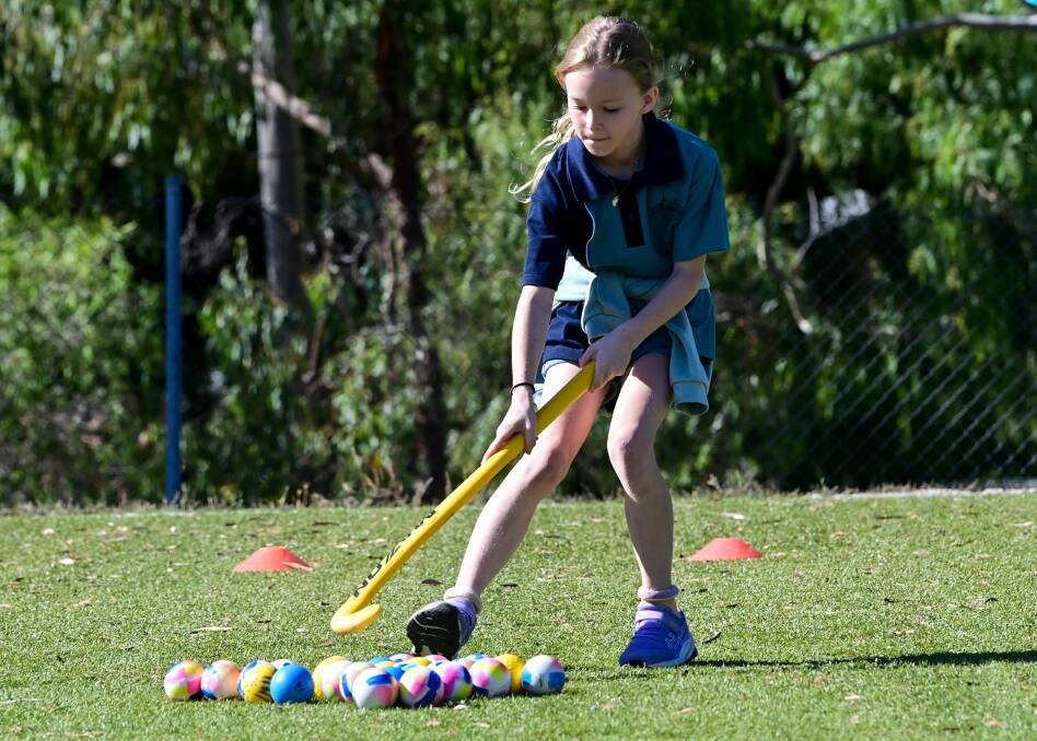 California Gully Primary School student Anika Armstrong refining her skills during a Hockey Victoria Roadshow skills clinic. Picture by Brendan McCarthy