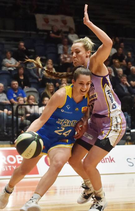 Maddie Garrick, while playing for the Melbourne Boomers, defends her now teammate Tessa Lavey during the 2019/20 WNBL season.