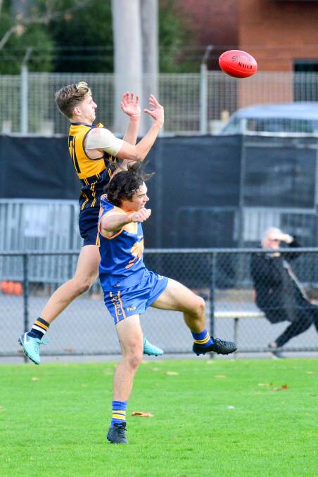 Catherine McAuley College's Ethan Featherby goes for a high-flyer during the 22-point victory over Bendigo Senior Secondary College on Wednesday afternoon. Picture: BRENDAN McCARTHY