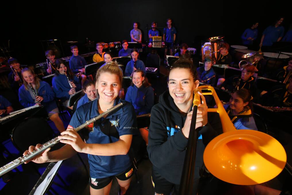 HIGH NOTES: Shyla Heal and Tessa Lavey get into the spirit of music with the Bendigo South East College senior band. Picture: GLENN DANIELS