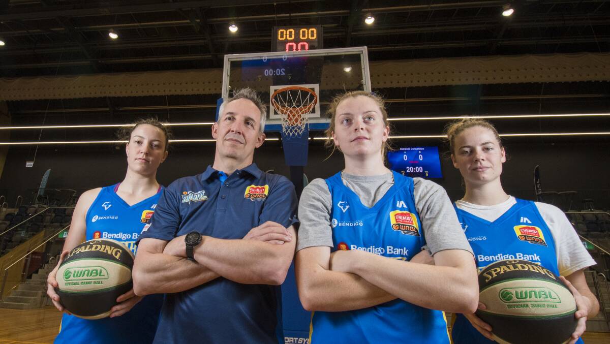IT'S OUR HOUSE: Bendigo Spirit will do whatever it takes to ensure straight victories on their home court at the Bendigo Stadium. Coach Simon Pritchard with Marena Whittle, Abbey Wehrung and Cassidy McLean. Picture DARREN HOWE