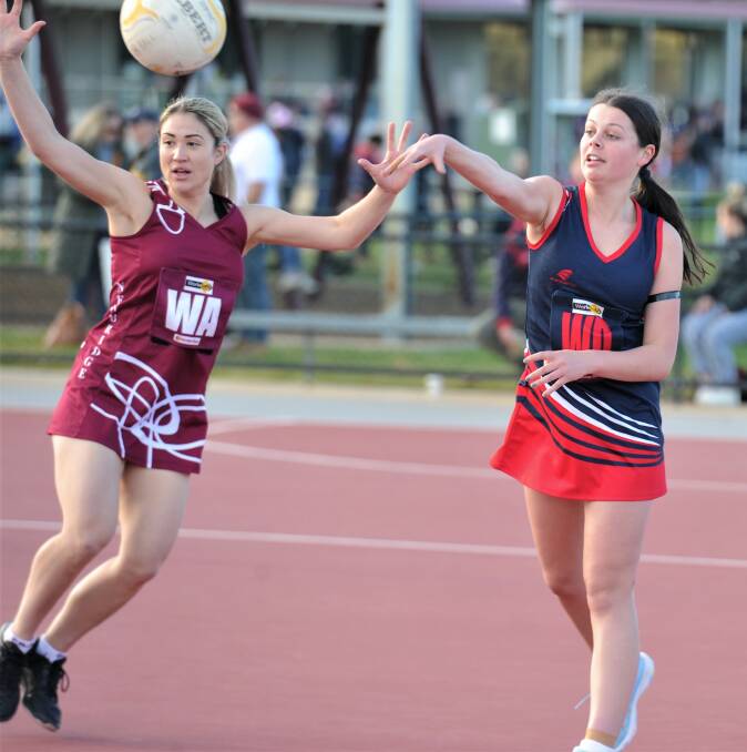 TRIBUTE MATCH: Amy Ryan keeps the pace high during the Demons 25-goal victory over the Maroons. Picture: ADAM BOURKE