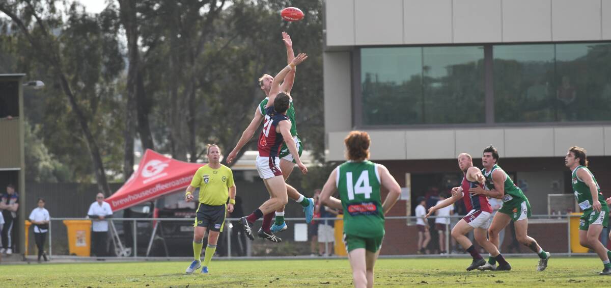 DRAGONS DELIVER: Sandhurst's Connor Sexton and Kangaroo Flat's Nick Lang go head-to-head in the Dragons' 102-point win over the Roos on Saturday at Dower Park. PICTURE: ANTHONY PINDA