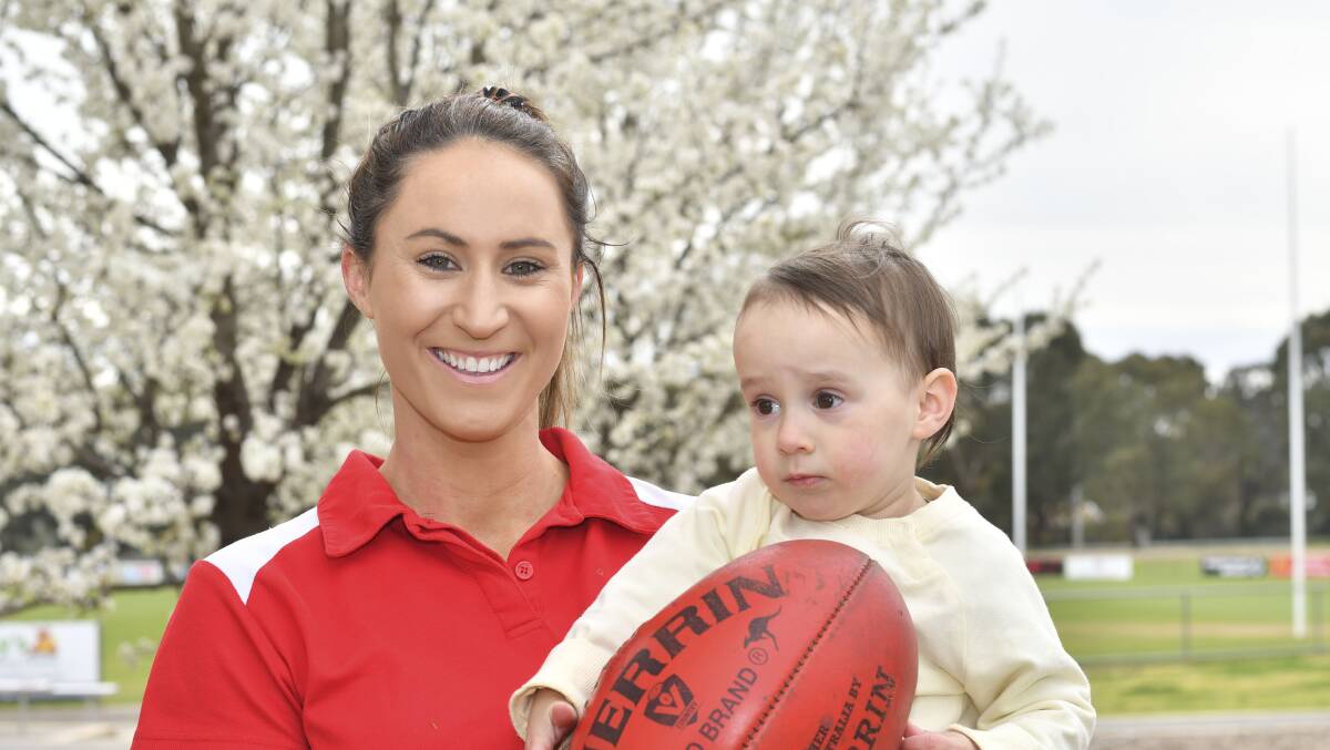 Danielle Coates loves inspiring children to be their best as sportspeople, which one day will include her daughter Caidie Coates. Picture: NONI HYETT 