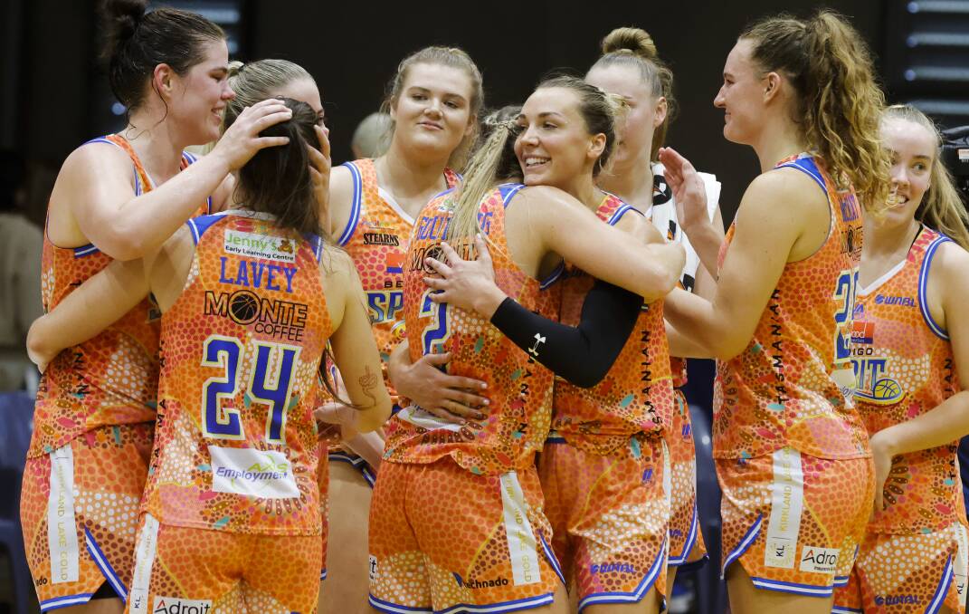 BEST OF THE REST: Bendigo Spirit players embrace each other after defeating Sydney Flames on Sunday to finish the 2021-22 regular season in fifth position on the ladder. Picture: GETTY IMAGES 