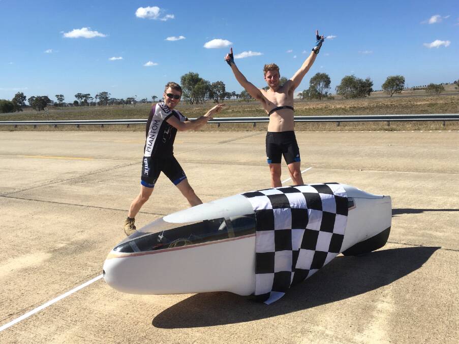TEAMWORK:  Dr Tim Corbett with Kyle Lierich after breaking the world record for the most distance travelled in six hours by a human powered vehicle. Picture: SUPPLIED