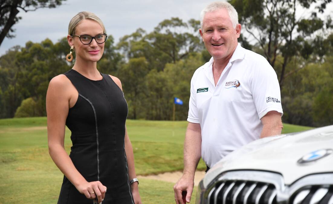 SUPPORT: Symes Motors BMW's Jacqueline Pinder with Axedale GC president Allan Andrews. Picture: ANTHONY PINDA