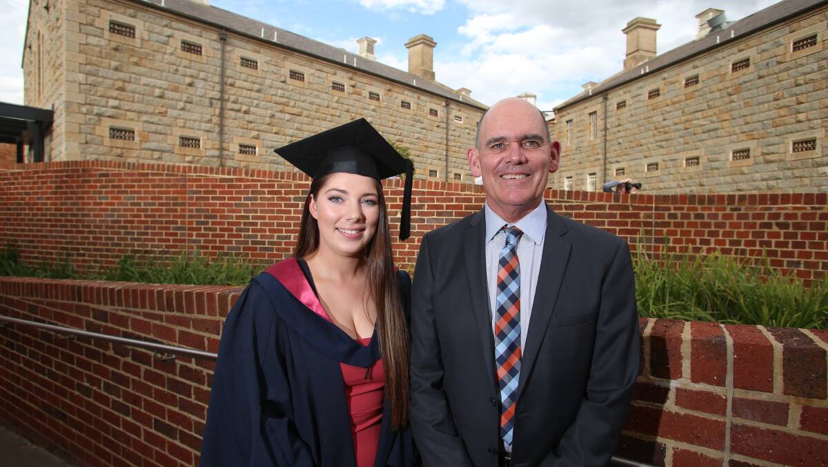 SCHOLARSHIP: La Trobe University Bachelor of Education graduate Gabrielle Ryan with Kluwell Publications director Andrew Coldwell. Picture: GLENN DANIELS
