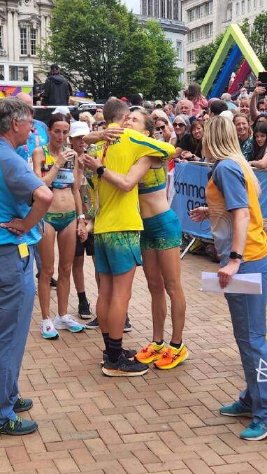 CAMARADERIE: Andy Buchanan congratulates Jess Stenson after she won gold in the women's marathon. Picture: ATHLETICS AUSTRALIA