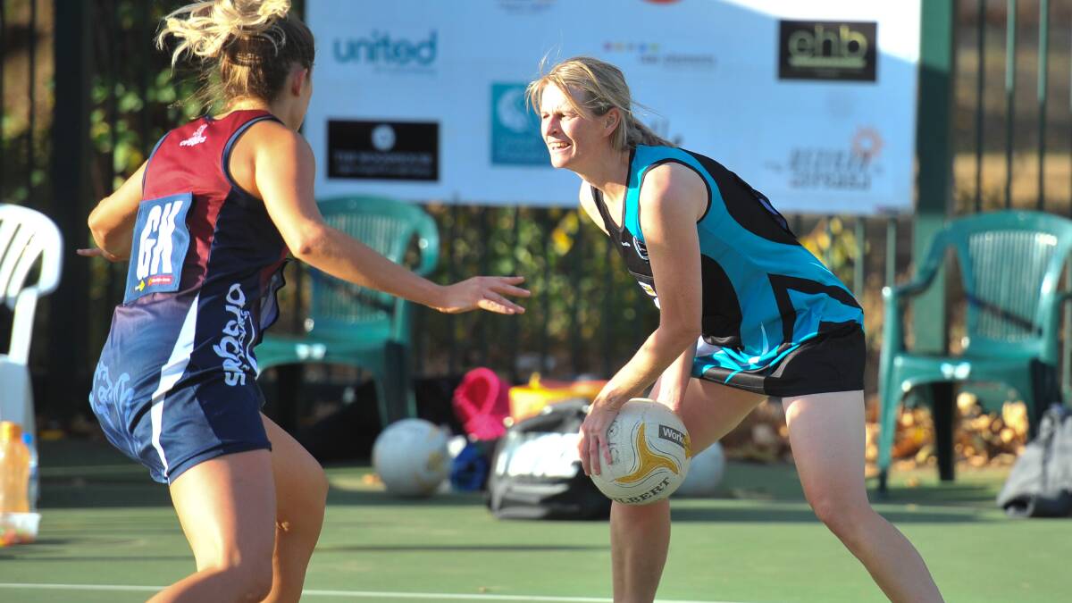 TEAM PLAYER: Maryborough great Alicia Cassidy looks for a team-mate against Sandhurst.