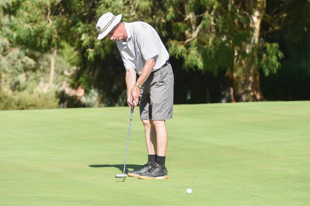 PERFECT PACE: Bill Coyle hits a downhill putt at Bendigo Golf Club while enjoying a day out on the course with good weather. Picture: DARREN HOWE