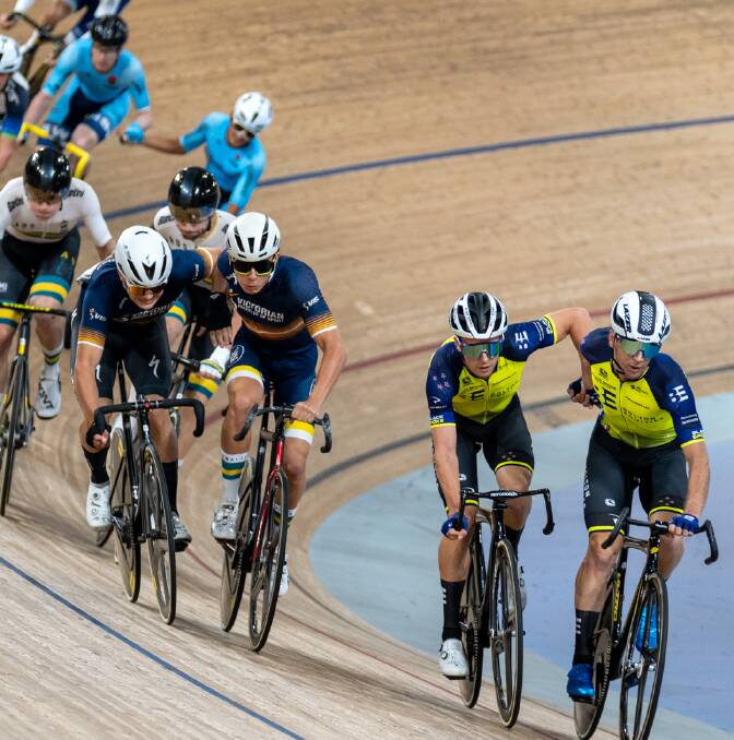 Blake Agnoletto (left) and UCI Track Nations Cup teammate Oli Bleddyn sling hands during the Oceania Track Championships madison event in Brisbane last year. Picture by Michael Shippley (AusCycling)