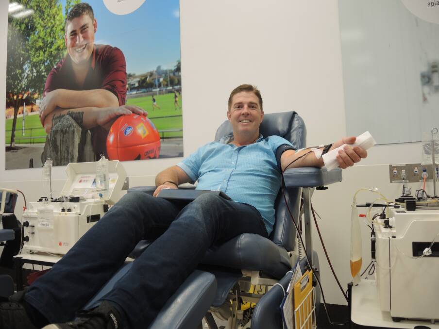 DONATE: Glenn McMahon relaxing at the Bendigo Donor Centre while he donates blood. Picture: ANTHONY PINDA.