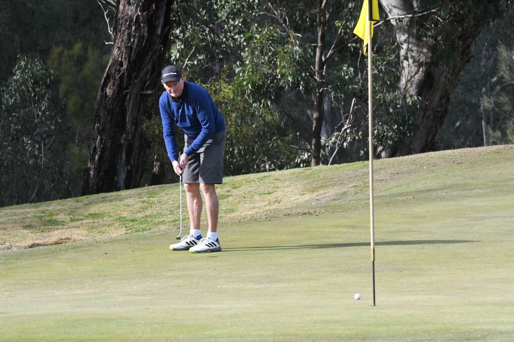 GOOD ROLL: Roger Heider watches as his putt creeps towards the hole.