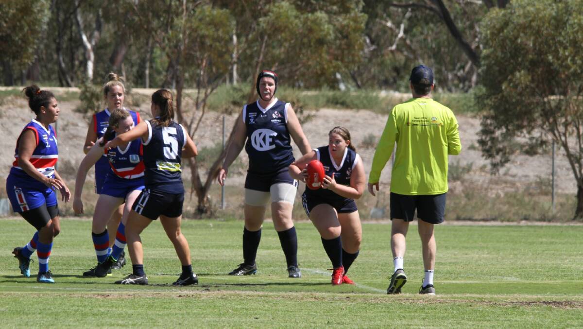 Kerang Women's Football Club players in action.