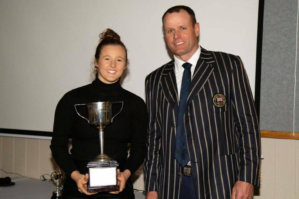 CLUB CHAMPION: Former British Olympic rowing coach Richard Hamilton presented the award to Livia Rosaia at the BRC's annual awards night. Rosaia won several gold medals at various events during the previous regatta season.