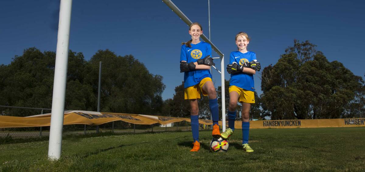 SIGNED: Ava (left) and Marlah have been given the opportunity to play with Calder United SC in the National Premier League Women's junior divisions. Picture: DARREN HOWE