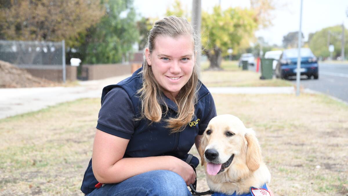 Vision Australia Seeing Eye Dog development trainer Britt McCarthy with Lorrie. Picture: ANTHONY PINDA