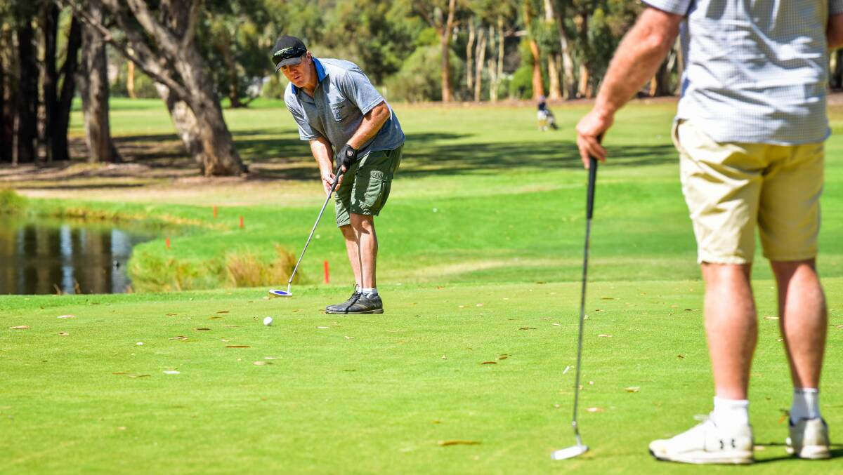 ON THE GREEN: Golfer Grant Stonehouse makes a putt on the ninth green at Neangar Park Golf Club on Sunday afternoon. Picture: BRENDAN McCARTHY