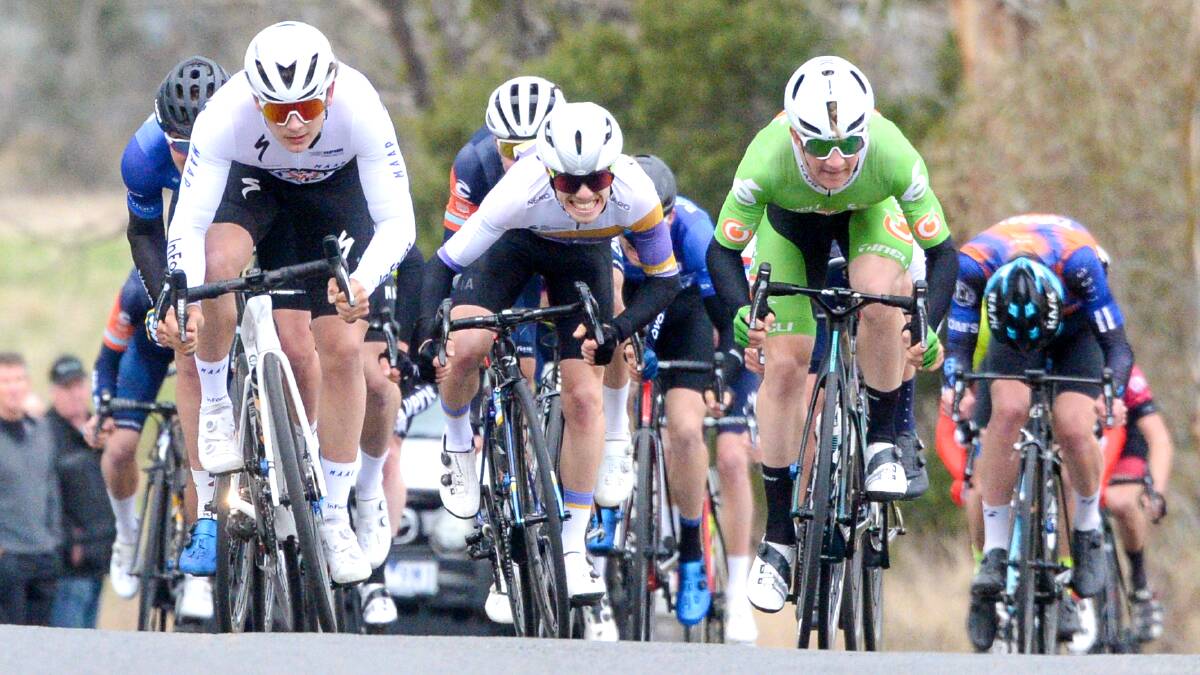 ROAD WARRIOR: Dylan McKenna, middle, on his way to victory in the three-day tour. Picture: DARREN HOWE