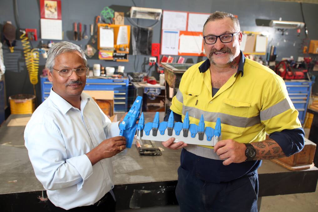 NEW DEVELOPMENTS: Dr Bala Hebbar and Brad Clark with 3D printed models of Keech's new mining equipment products. Picture: GLENN DANIELS