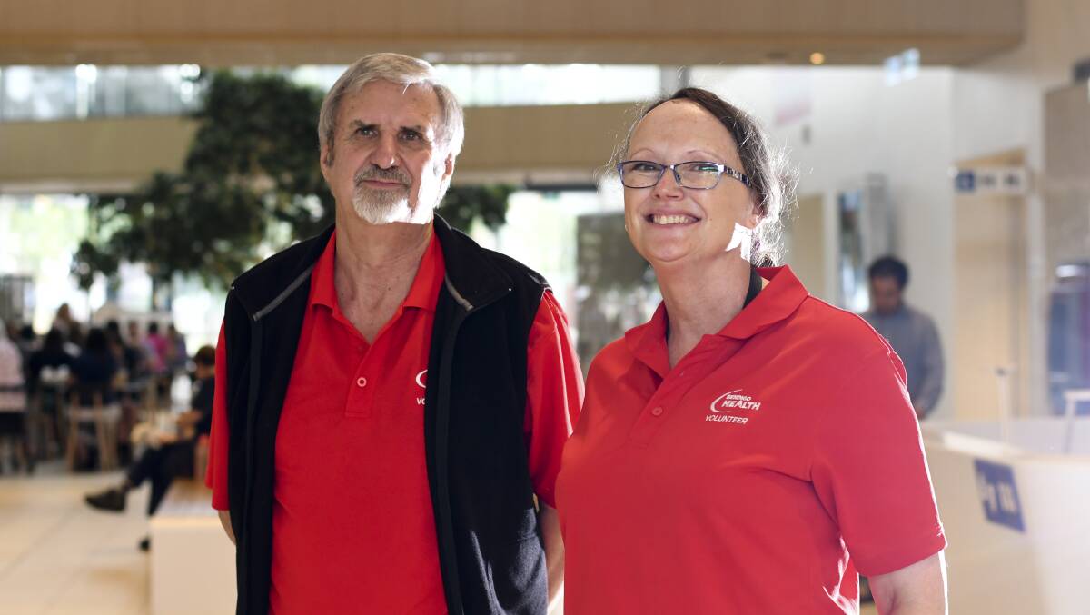 LEND A HAND: Bendigo Health volunteers Wayne Darby and Ann-Maree Jarrett generously offer their time to help patients and staff at the hospital. Picture: NONI HYETT