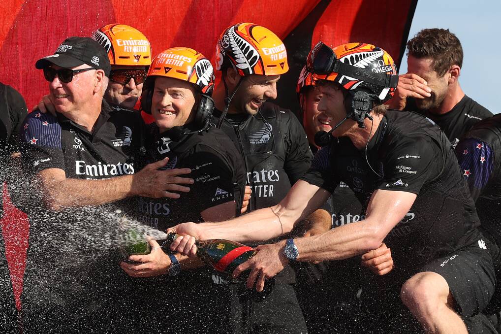 WINNERS: Glenn Ashby and the Team New Zealand crew celebrate the 7-3 America's Cup victory over Luna Rossa on Wednesday afternoon. Picture: GETTY IMAGES