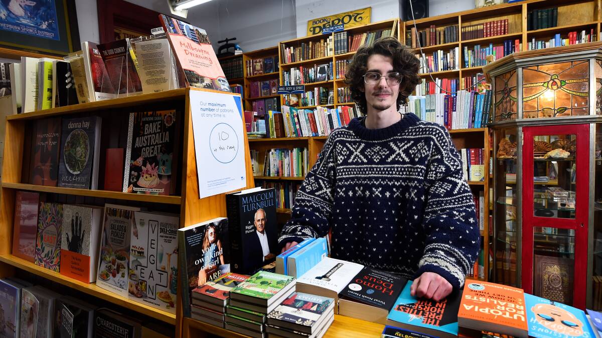 COMMUNITY SUPPORT: Lachy John of Paradise Bookstore in Daylesford is calling on community members to continuing to support local businesses. Pictures: Adam Trafford.