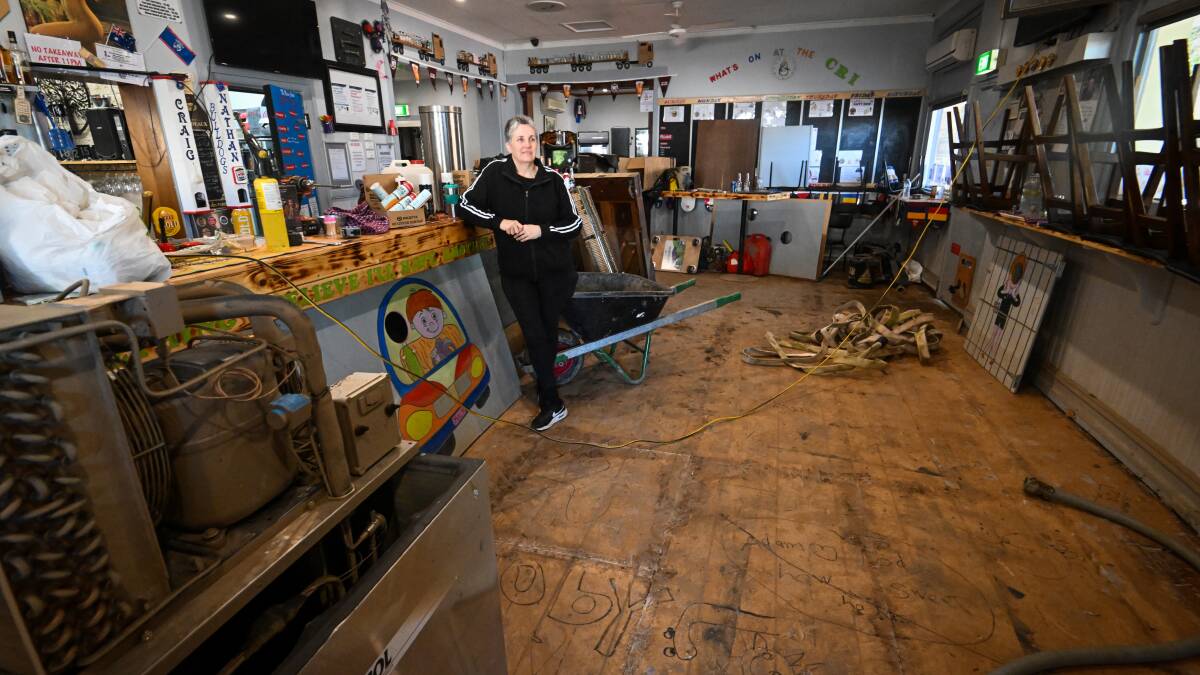 Criterion Hotel owner Theresa Mann in surveys the damage to the pub following Rochester's floods. Picture by Darren Howe
