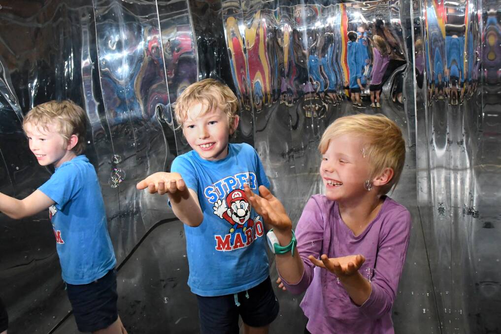 PLENTY to SMILE ABOUT: Fraser and Zoe Dullard get a sneal peak at Discovery Centre ahead of its reopening. Picture: NONI HYETT