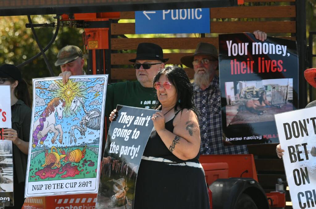 Protesters out the front of Bendigo Racecourse ahead of the 2019 Bendigo Cup. Picture: NONI HYETT