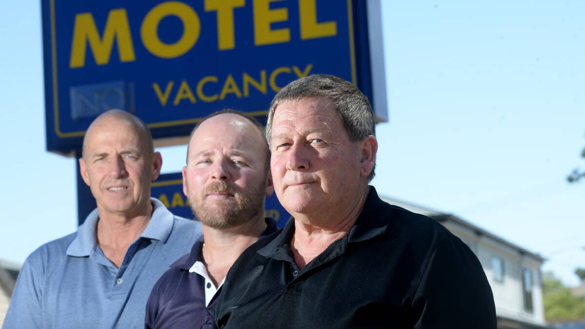 PROPRIETORS: Bendigo Motel owners Charlie Loftus with Simon Wurf and Brent Curran are concerned about the rise of Airbnb. Picture: DARREN HOWE