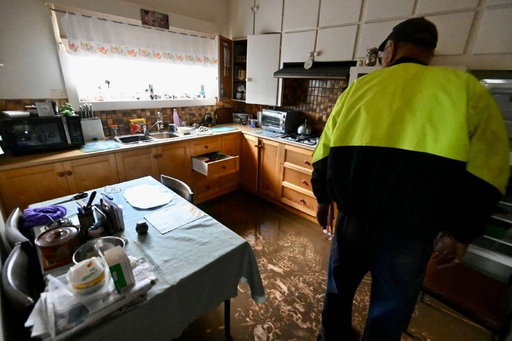 Wayne Edwards inspects the damage to his aunties house in Rochester on Sunday afternoon. Pictures by Darren Howe