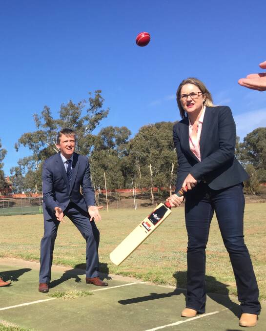 Catherine McAuley College principal Brian Turner and Member for Bendigo East Jacinta Allen show off their cricket skills.