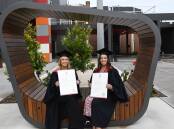 Sisters Aish and Kealy Tupper graduated with their nursing degrees together on Thursday. The pair are now working at Bendigo Health. Picture: Chris Pedler