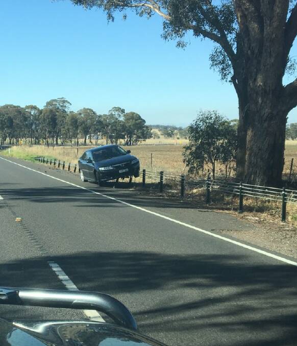 STOPPED: The Mazda resting on the wire barrier. Picture: Twitter