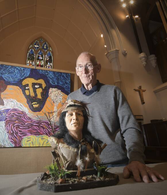COLOUR: Reverend Ian Smith with two works that will feature in this weekend's St Paul's Art Prize exhibition at the cathedral in Myers Street. Picture: NONI HYETT