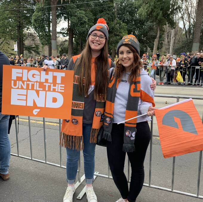 Bendigo GWS fans Paige Allison and Chloe Whittle at the grand final parade on Friday. The two fans will also go to the game on Saturday. Picture: SUPPLIED 