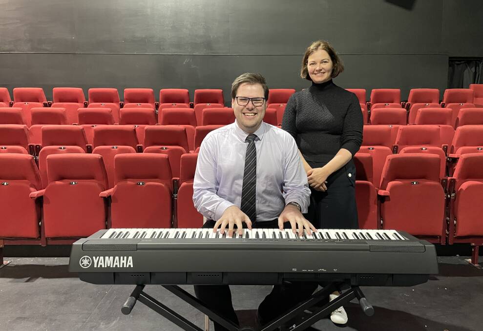 STRONG SOUNDS: Bendigo Theatre Company president Bevan Madden plays the company's new keyboard as Bendigo MP Lisa Chesters looks on. Picture: CHRIS PEDLER
