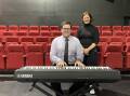 STRONG SOUNDS: Bendigo Theatre Company president Bevan Madden plays the company's new keyboard as Bendigo MP Lisa Chesters looks on. Picture: CHRIS PEDLER