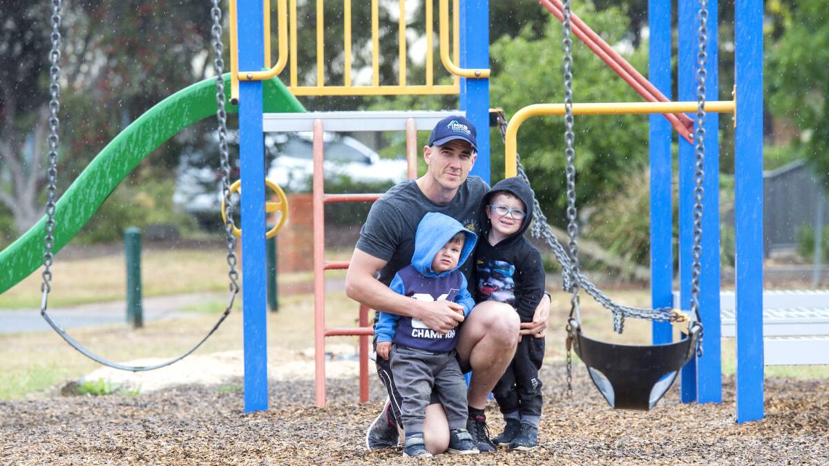 PLAYTIME: Lachlan O'Toole with his sons Cooper and Ollie at the Melbury Court playground. Picture: DARREN HOWE
