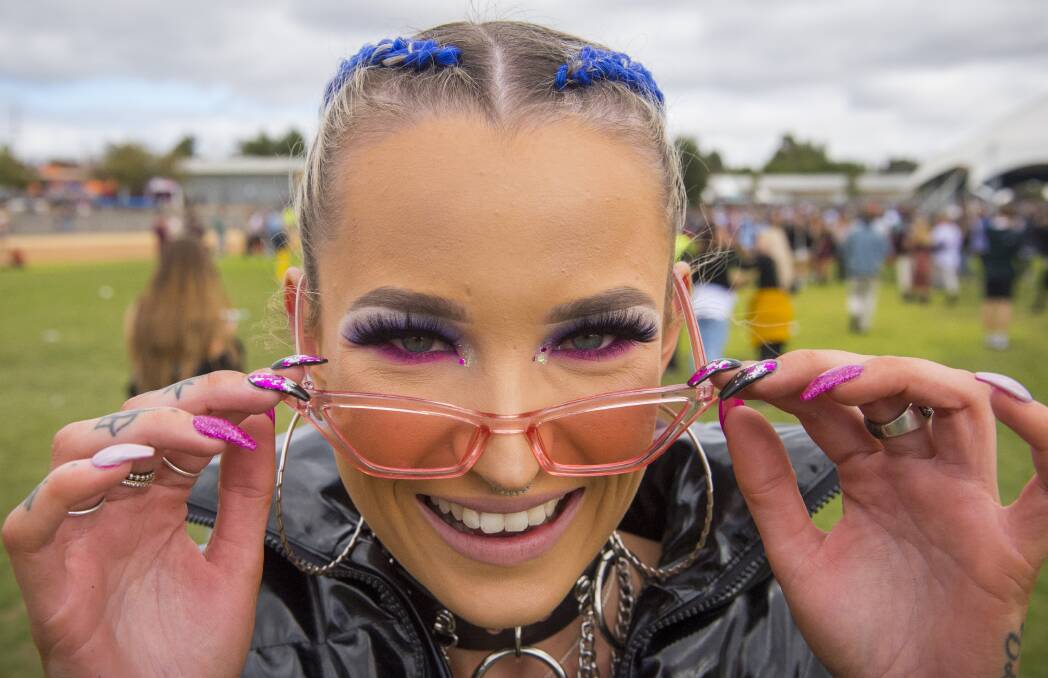 Glitter and coloured braids are popular choices for people at this year's GTM. Picture: DARREN HOWE